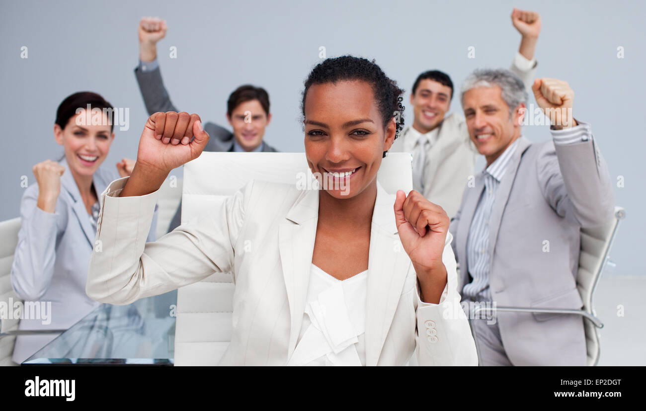 Happy multi-ethnic business team celebrating a sucess Stock Photo - Alamy