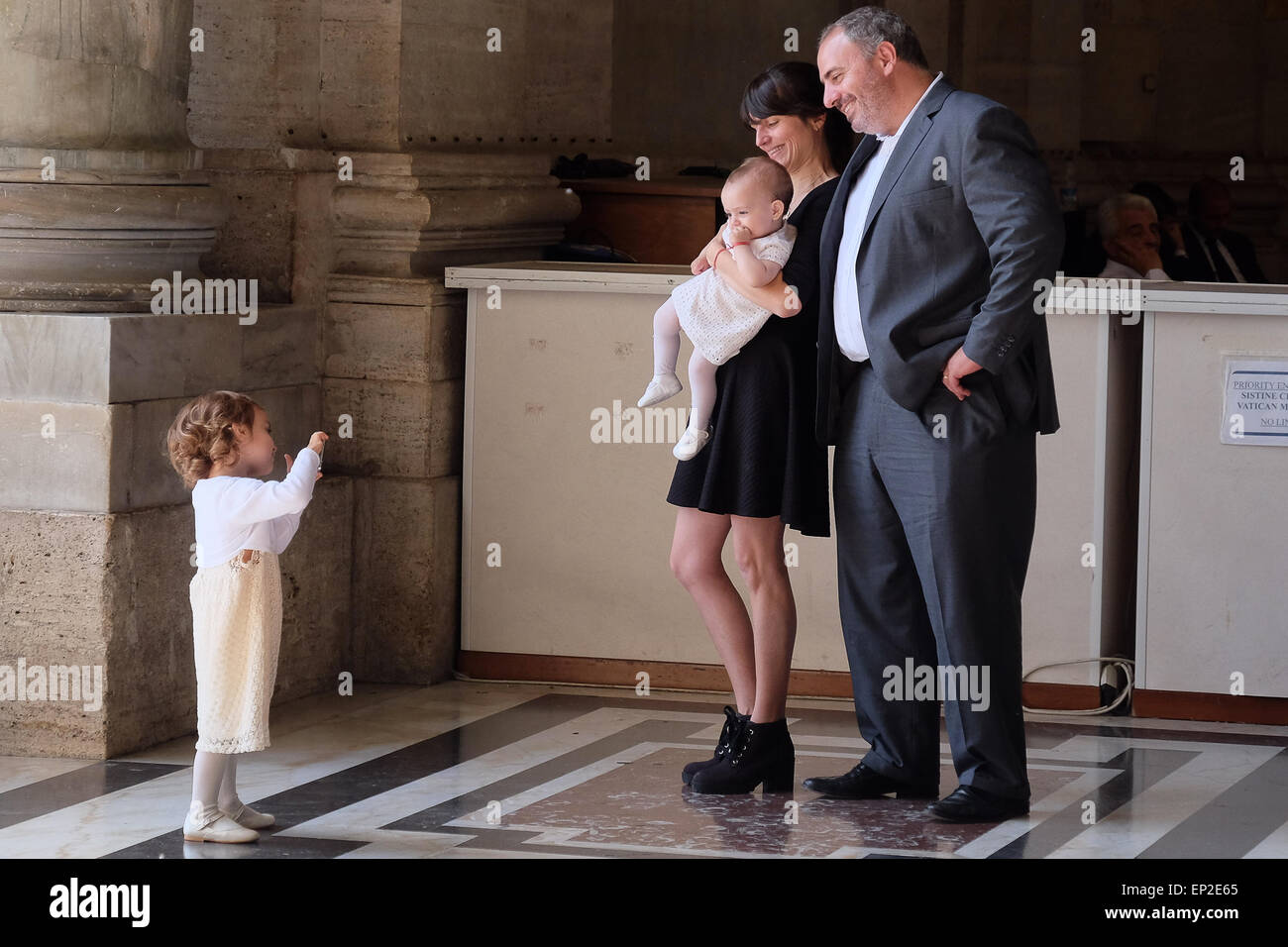 Vatican City. 13th May, 2015. A child take a photo of her parents during the speech of Pope Francis - General Audience of 13 May 2015, St. Peter square, Vatican Credit:  Realy Easy Star/Alamy Live News Stock Photo