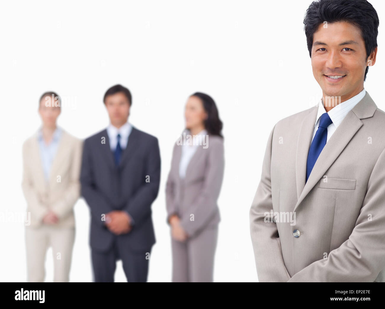 Businessman standing with his colleagues behind him Stock Photo - Alamy