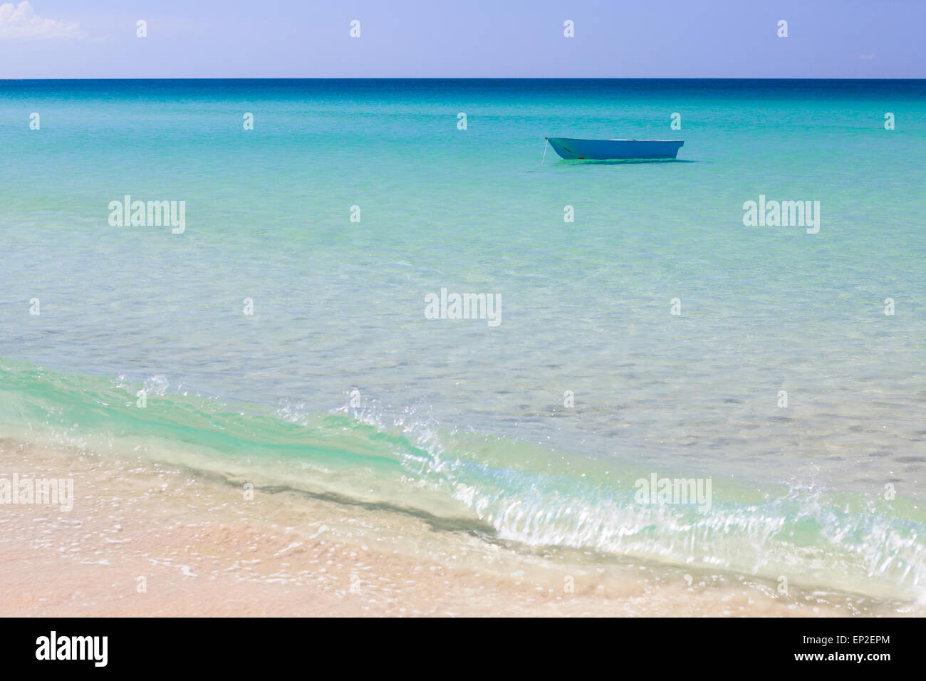 Fisher boat and clear turquoise water Stock Photo - Alamy