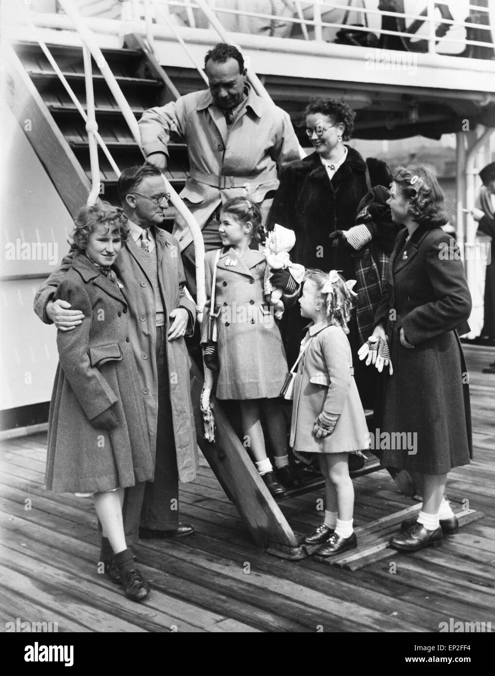 Two families on board the liner 'Cameronia' at Liverpool docks, having returned from Australia where they had emigrated eighteen months previously. The families were quoted as saying that they would 'rather die in England than live in Australia'. 8 April, 1951. Stock Photo