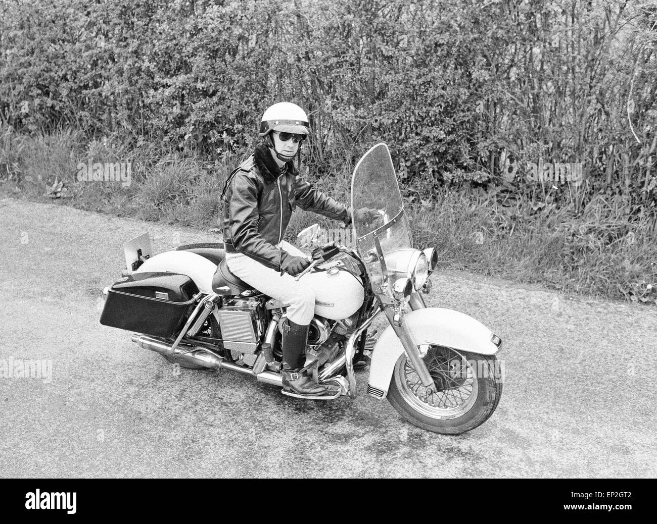 American police enthusiast John Hayes wearing the uniform of LA City Police  officer and white helmet as he goes for a ride on his Harley Davidson  motorcycle. May 1977 Stock Photo - Alamy