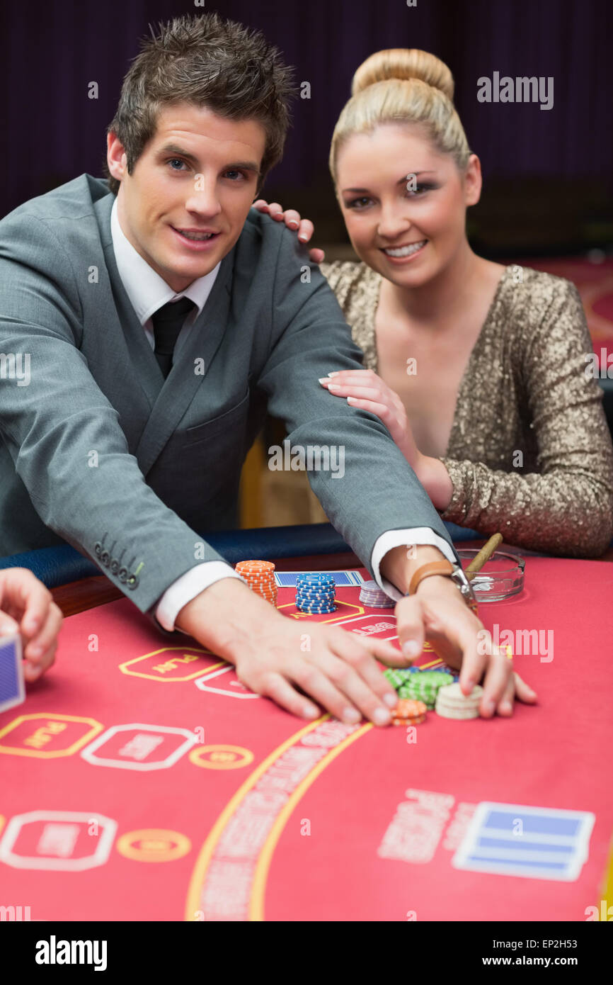 Man happily taking the pot with women beside him Stock Photo Alamy