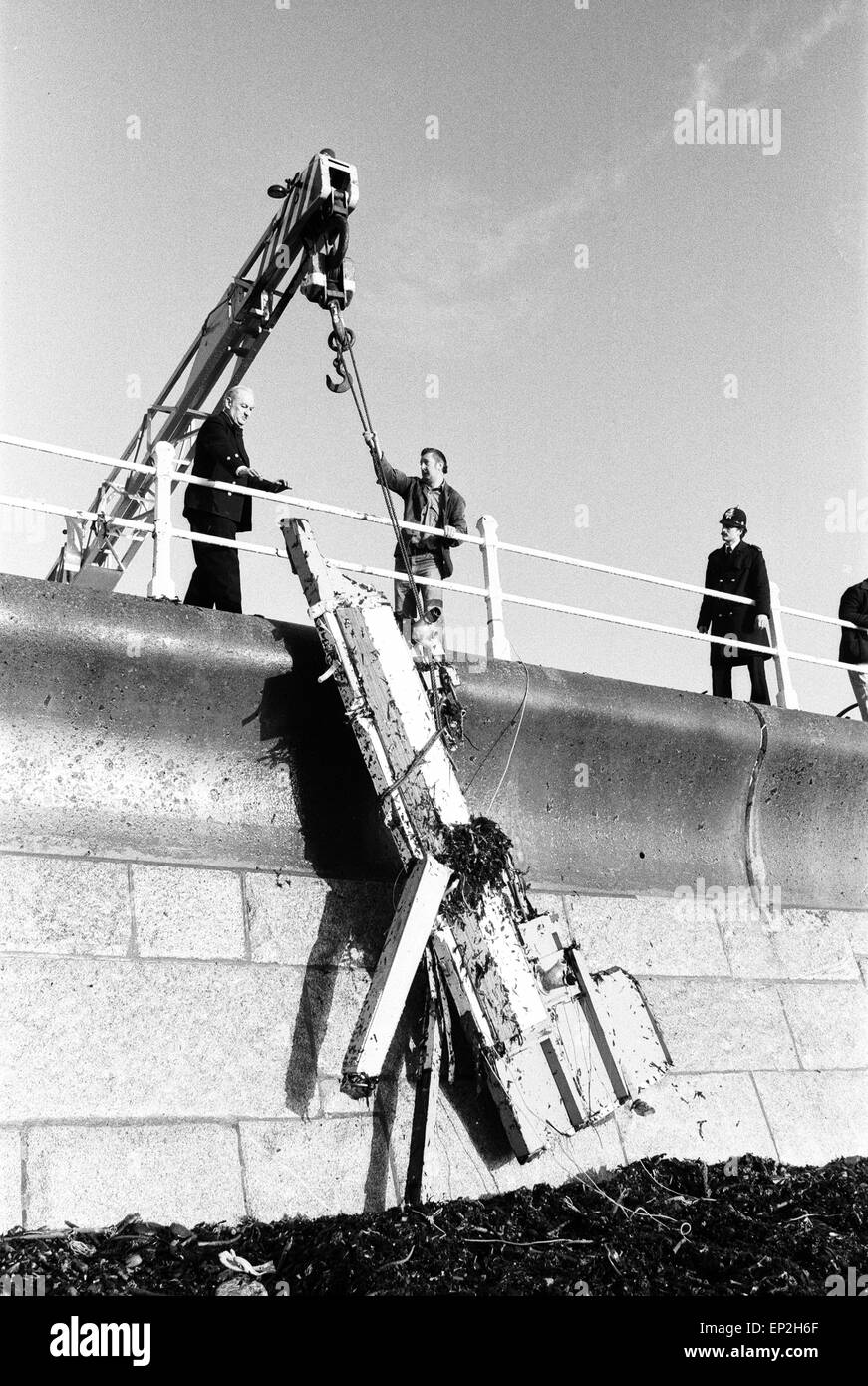 Penlee Life Boat Disaster wreckage from the lifeboat is brought ashore Monday 21st December 1981. The Penlee life boat was launched from the Cornish village of Mousehole at exactly 20:12 on Saturday night (19th) after the freighter Union Star sent out distress call. At 21:22 coxswain Trevelyan Richards radioed that he had managed to get four people aboard. Then there was silence. All hope has now been abandoned for the lifeboatmen and the eight people from the freighter. The Union Star on its maiden voyage lays capsized and shattered at the foot of cliffs at Tater Du just along the coast. Stock Photo