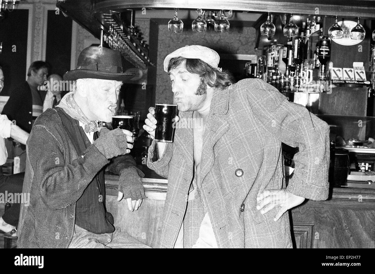 Steptoe and Son actors enjoy a pint in local pub, during break in filming of the BBC Comedy Series, Shepherds Bush, London, 20th August 1974. Actors : Wildred Brambell whp plays Albert Steptoe & Harry H Corbett his son Harold Steptoe. Stock Photo