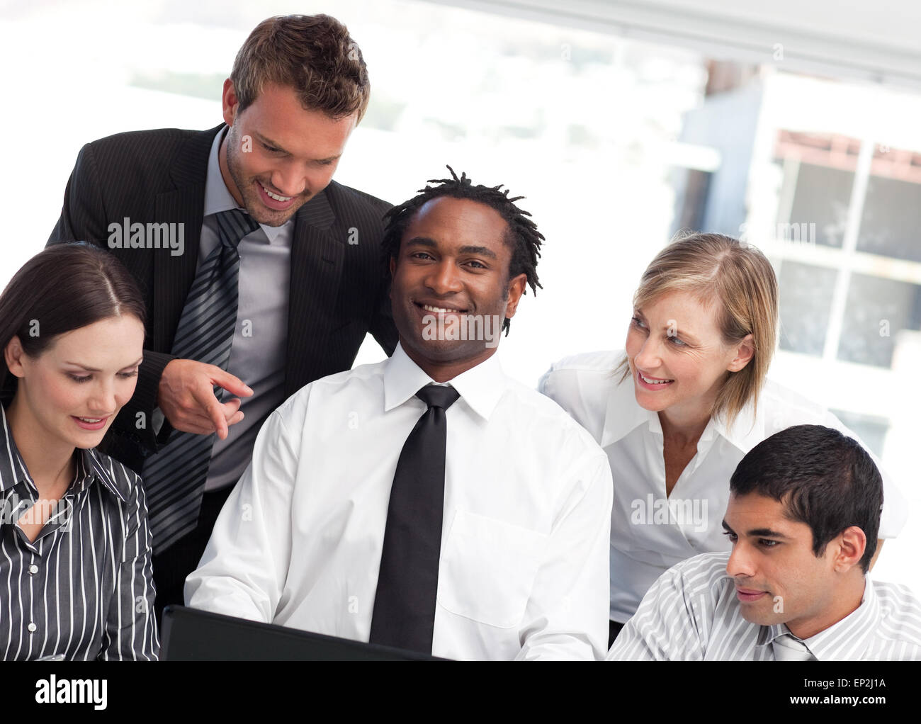 Multi-ethnic business team together in an office Stock Photo - Alamy