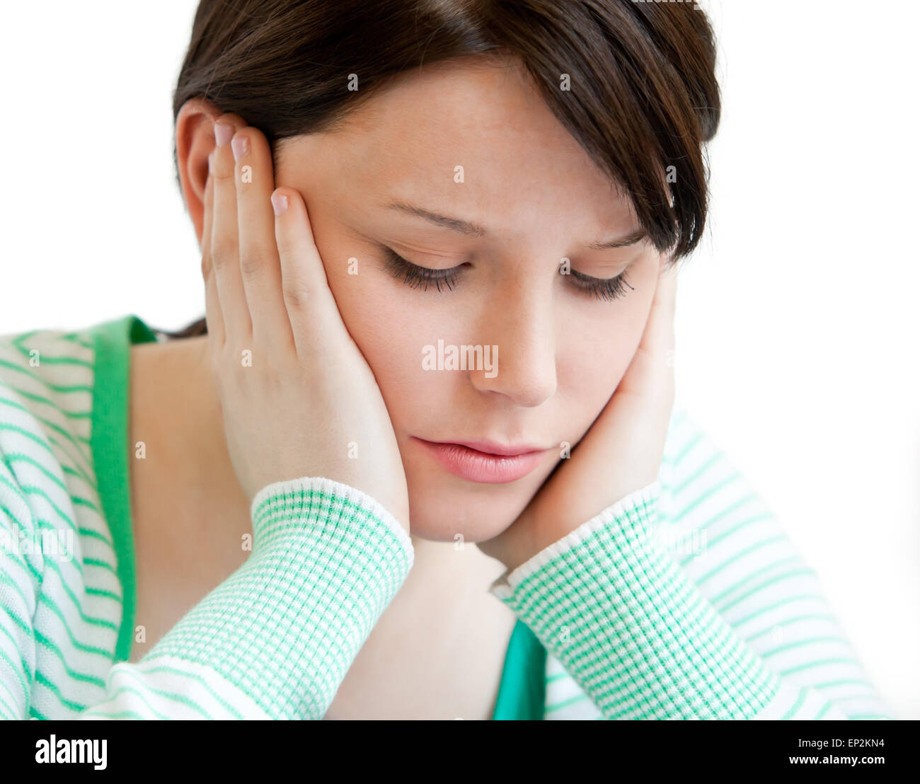 Portrait of a depressed teenager holding up her head on her hands Stock ...