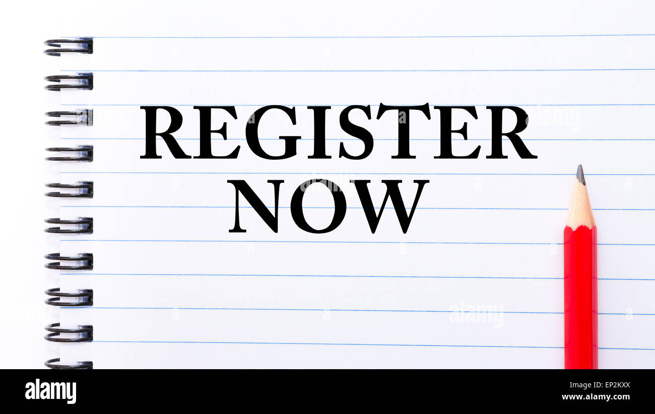 Register Now Text written on notebook page, red pencil on the right ...