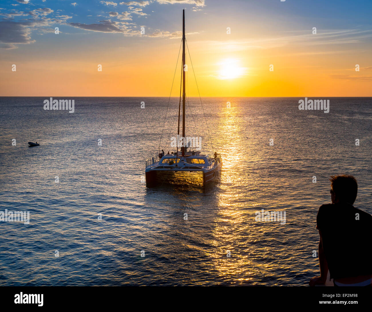 Jamaica, Negril, sailing boat near Rick's Cafe at the coast at sunset Stock Photo