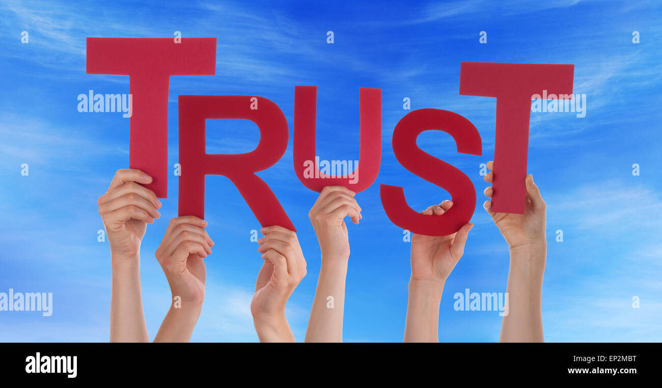 Many People Hands Holding Red Word Trust Blue Sky Stock Photo - Alamy