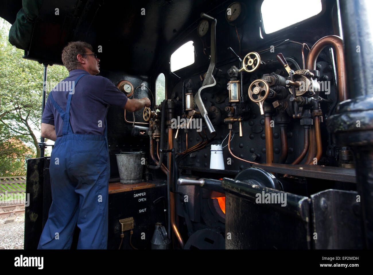 train driver on a steam locomotive at the Keighley and Worth Valley ...
