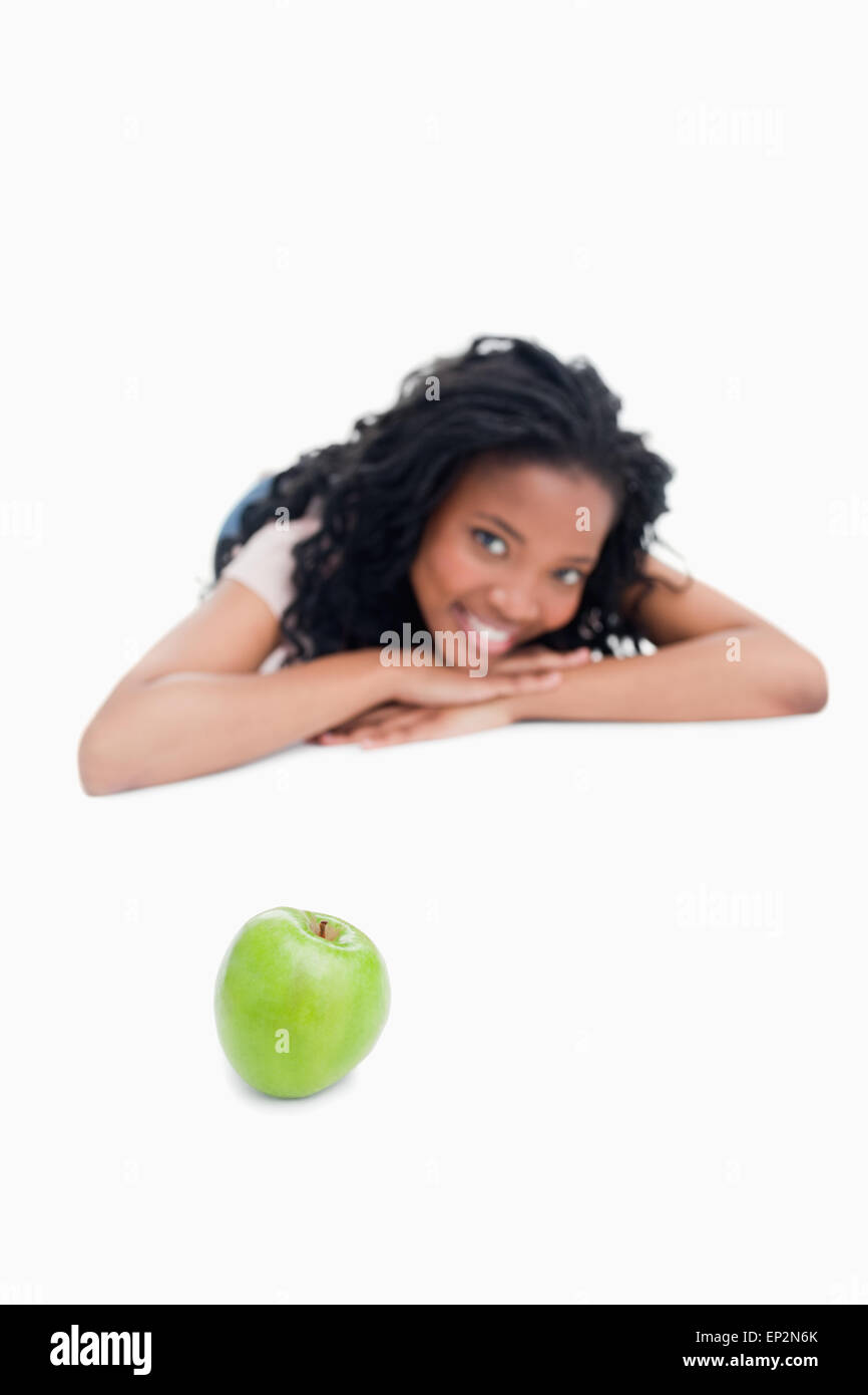 A green apple with a young girl in the background Stock Photo - Alamy
