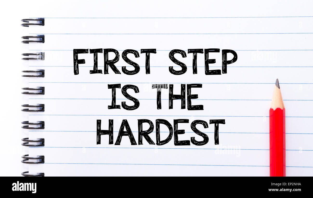 First Steps Text First Step is the Hardest Text written on notebook page, red pencil on ...