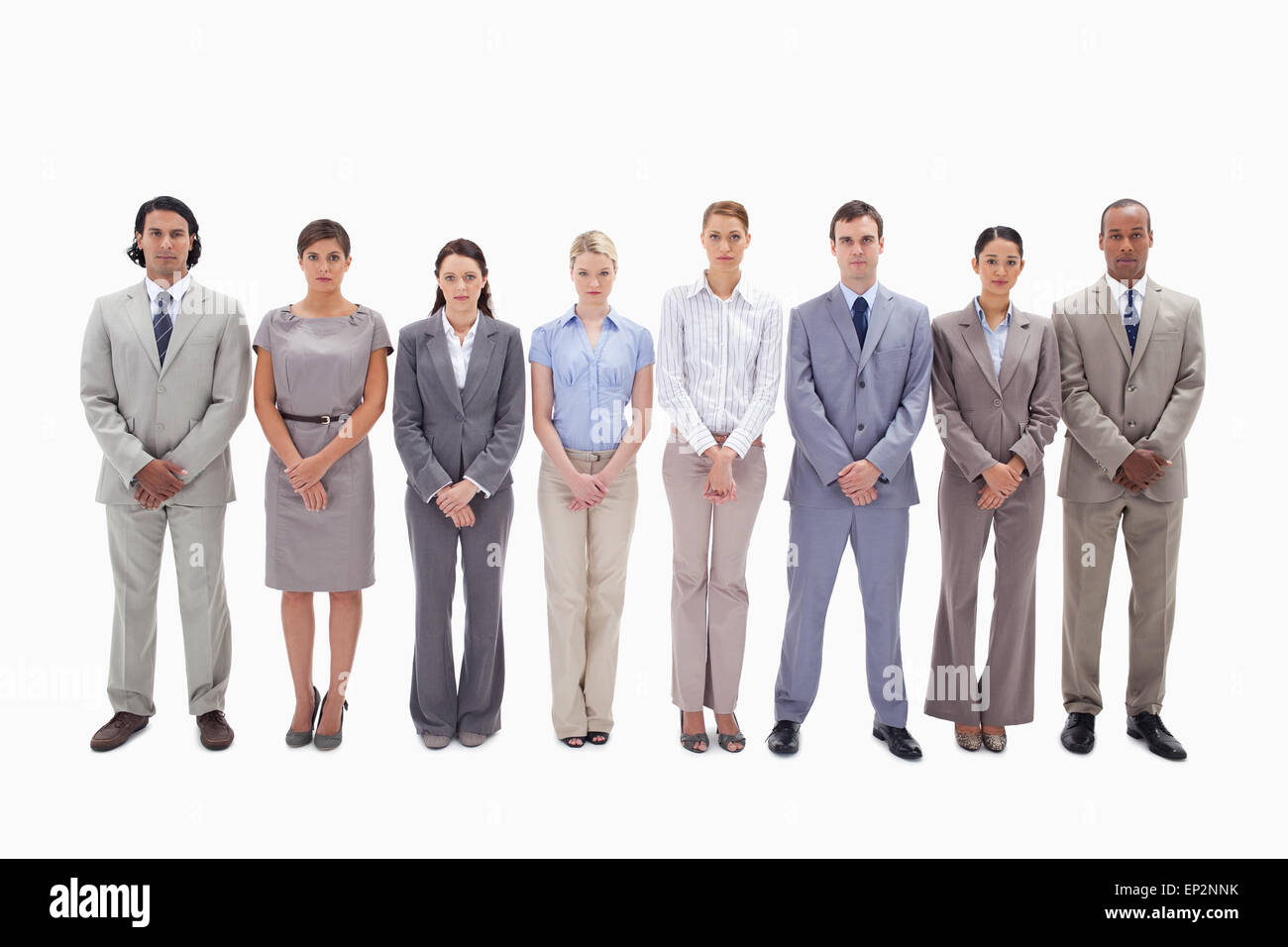 Serious business team side by side holding their hands Stock Photo - Alamy