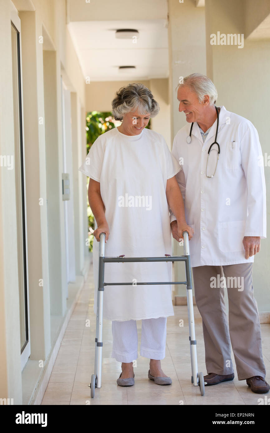 Doctor walking with his patient Stock Photo - Alamy