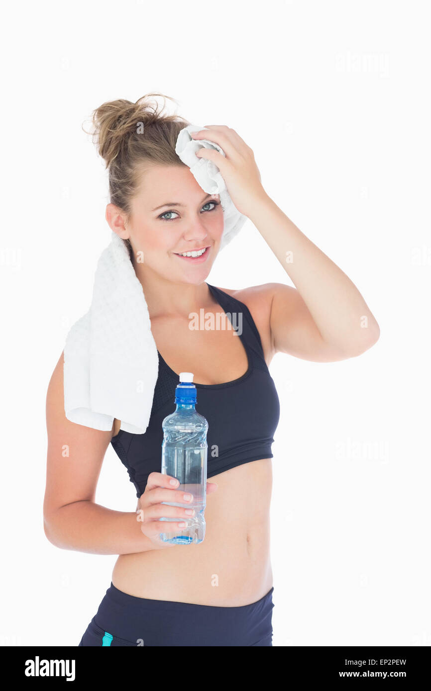 Woman standing while holding a towel to her forehead Stock Photo