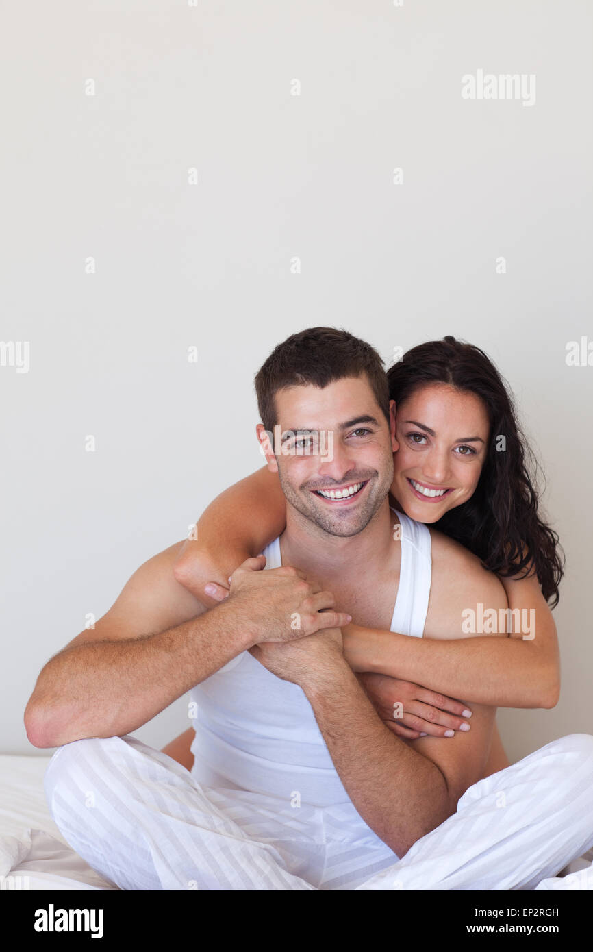 Handsome woman hugging her attractive boyfriend Stock Photo - Alamy