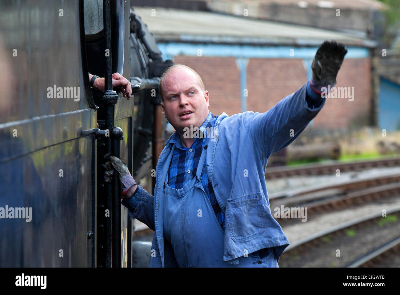 train driver on a steam locomotive at the Keighley and Worth Valley ...