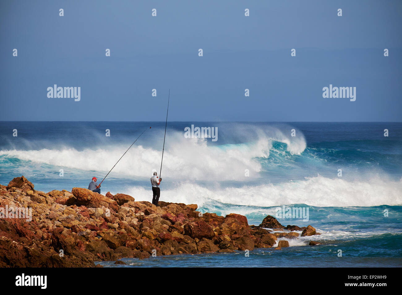 Portugal, Algarve, Sagres, two angler at Bodeira Beach Stock Photo