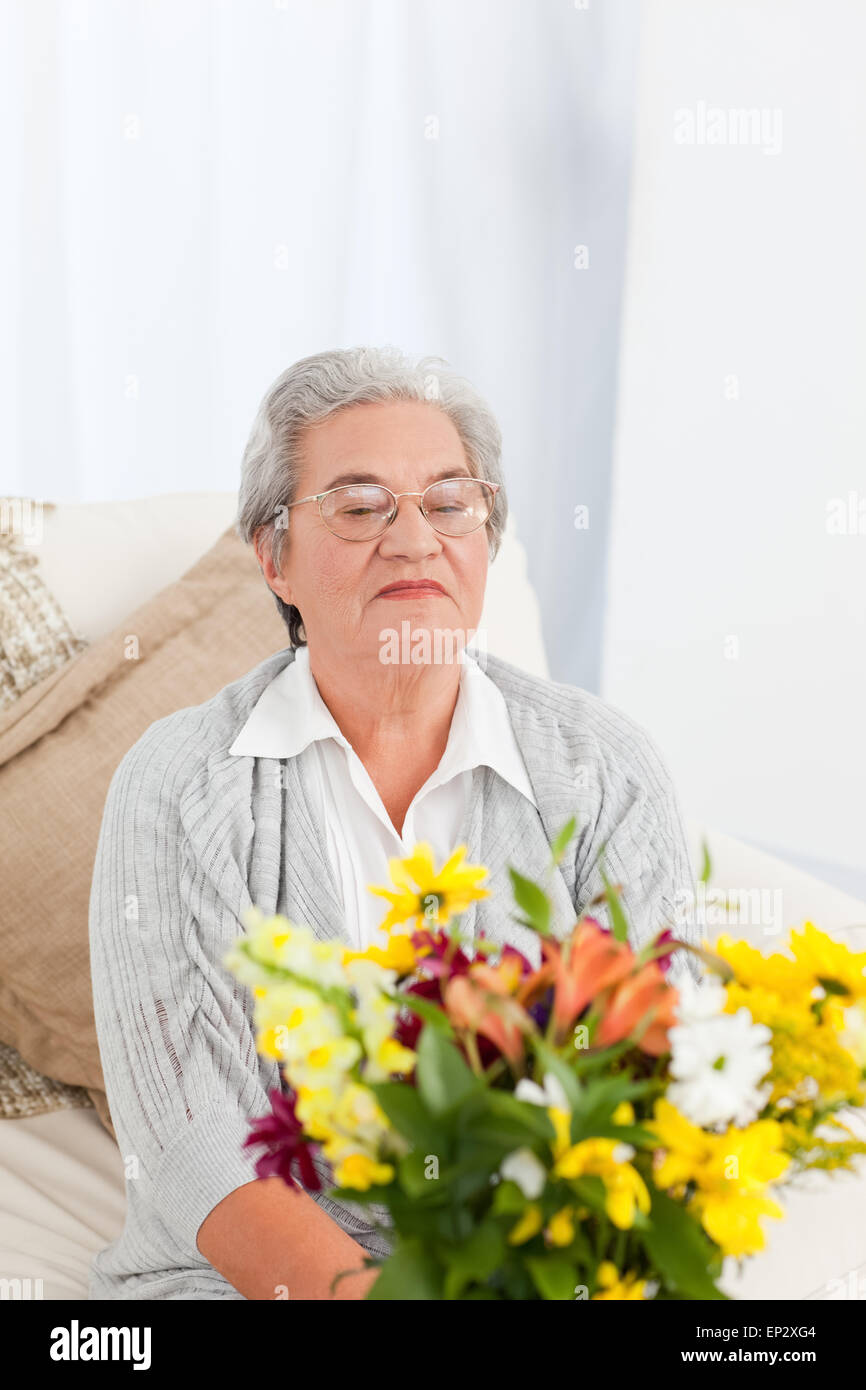 Senior woman with flowers Stock Photo - Alamy