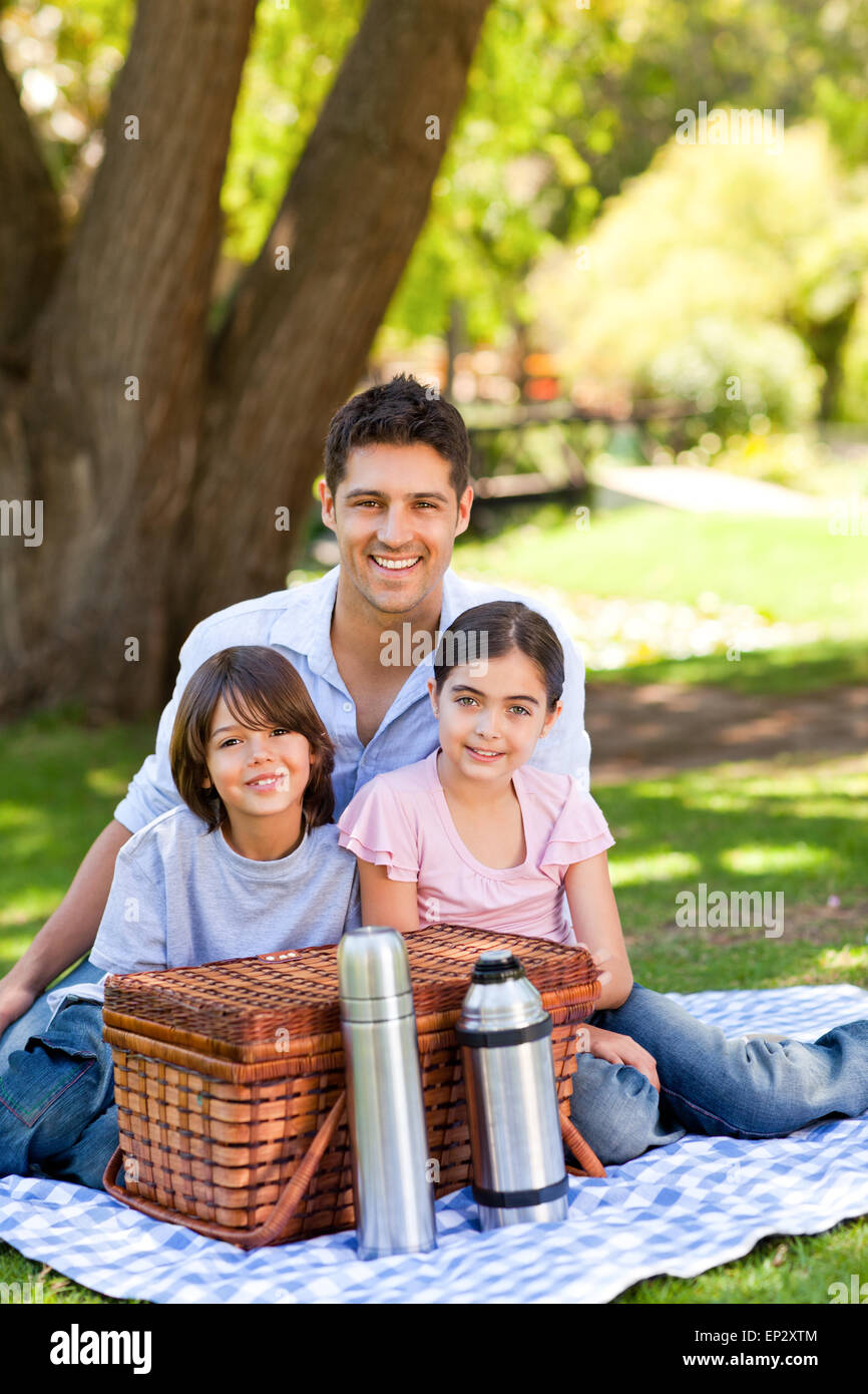 Happy family picnicking in the park Stock Photo - Alamy