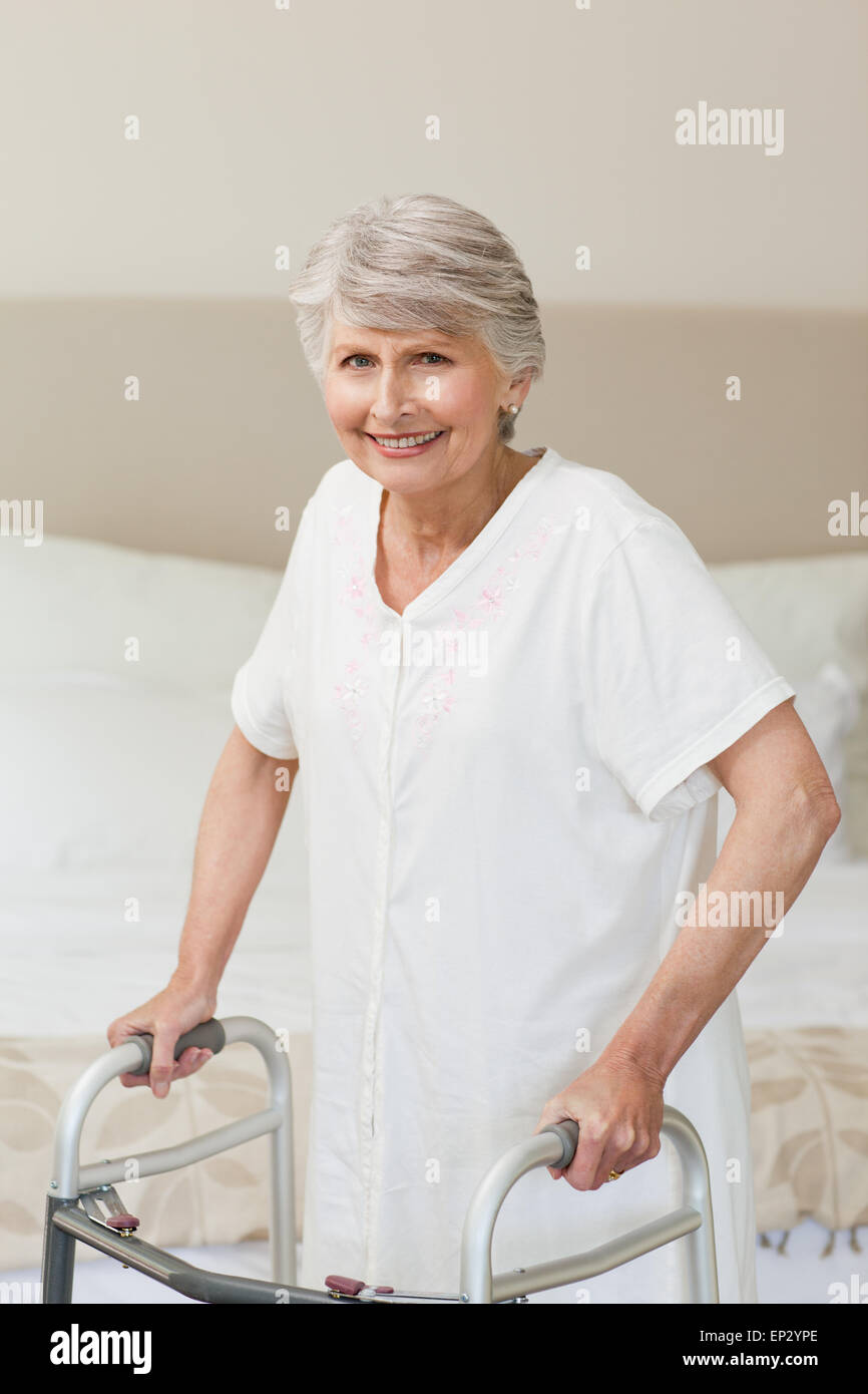Senior woman with her zimmer frame Stock Photo Alamy