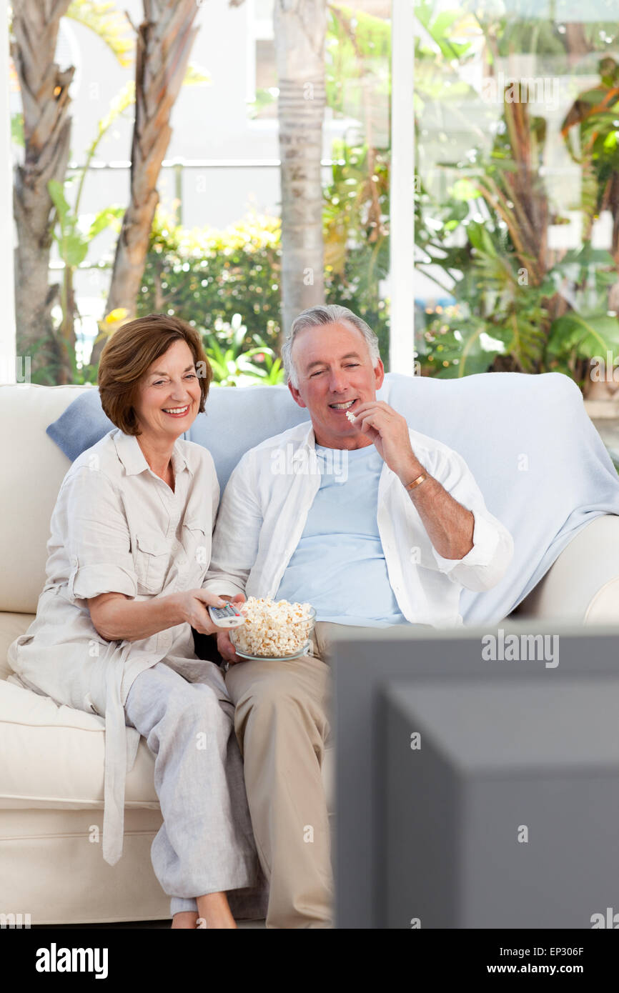 Seniors watching tv at home Stock Photo Alamy