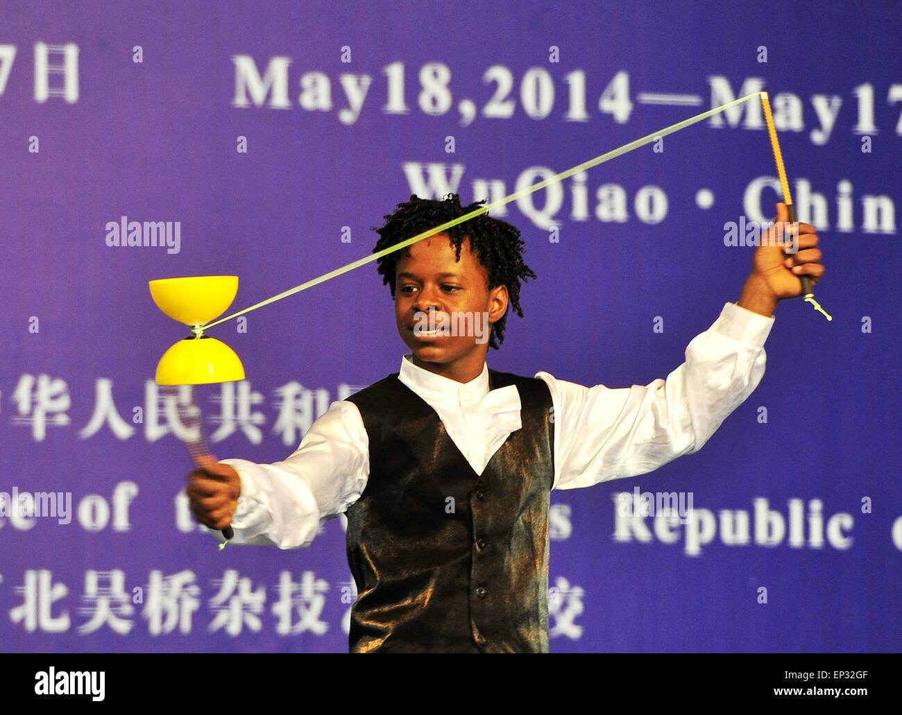 Cangzhou, China's Hebei Province. 13th May, 2015. An African student performs acrobatics on the commencement of their course in Cangzhou, north China's Hebei Province, May 13, 2015. Twenty-six students from English-speaking African countires took the one-year acrobatic course in Wuqiao International Acrobatic Art School and acquired skills of about 20 acrobatic shows. Wuqiao county, also known as 'the home of acrobatics' in china, has a history of acrobatics for more than 2000 years. © Mou Yu/Xinhua/Alamy Live News Stock Photo