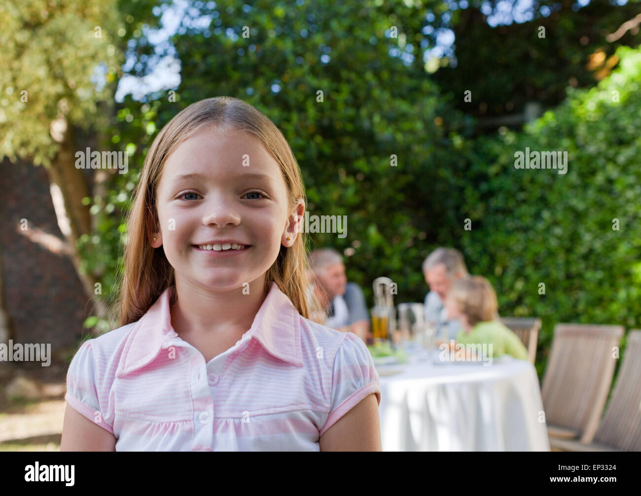 Little girl looking at the camera Stock Photo - Alamy