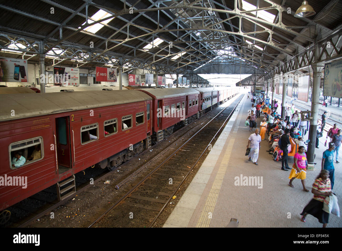 Train platform people inside Fort railway station, Colombo, Sri Lanka, Asia Stock Photo