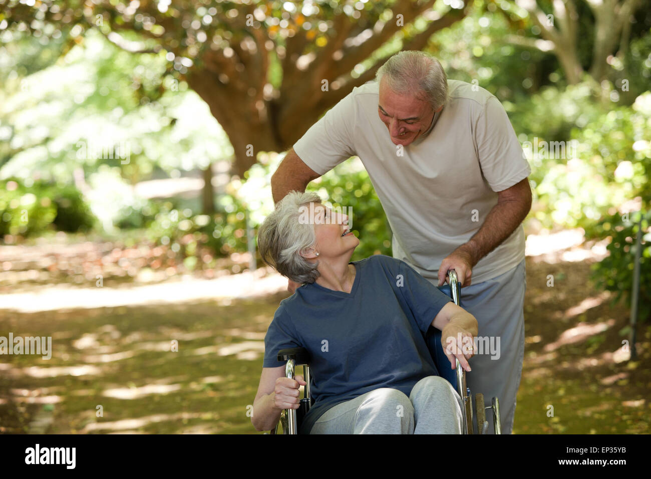 Senior couple in the woods Stock Photo - Alamy