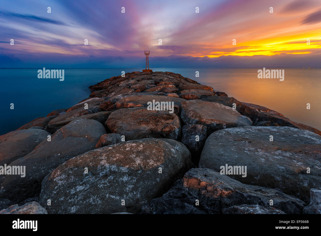 Light beacon and rocky wave breaker near Acroyali village, Messinia ...