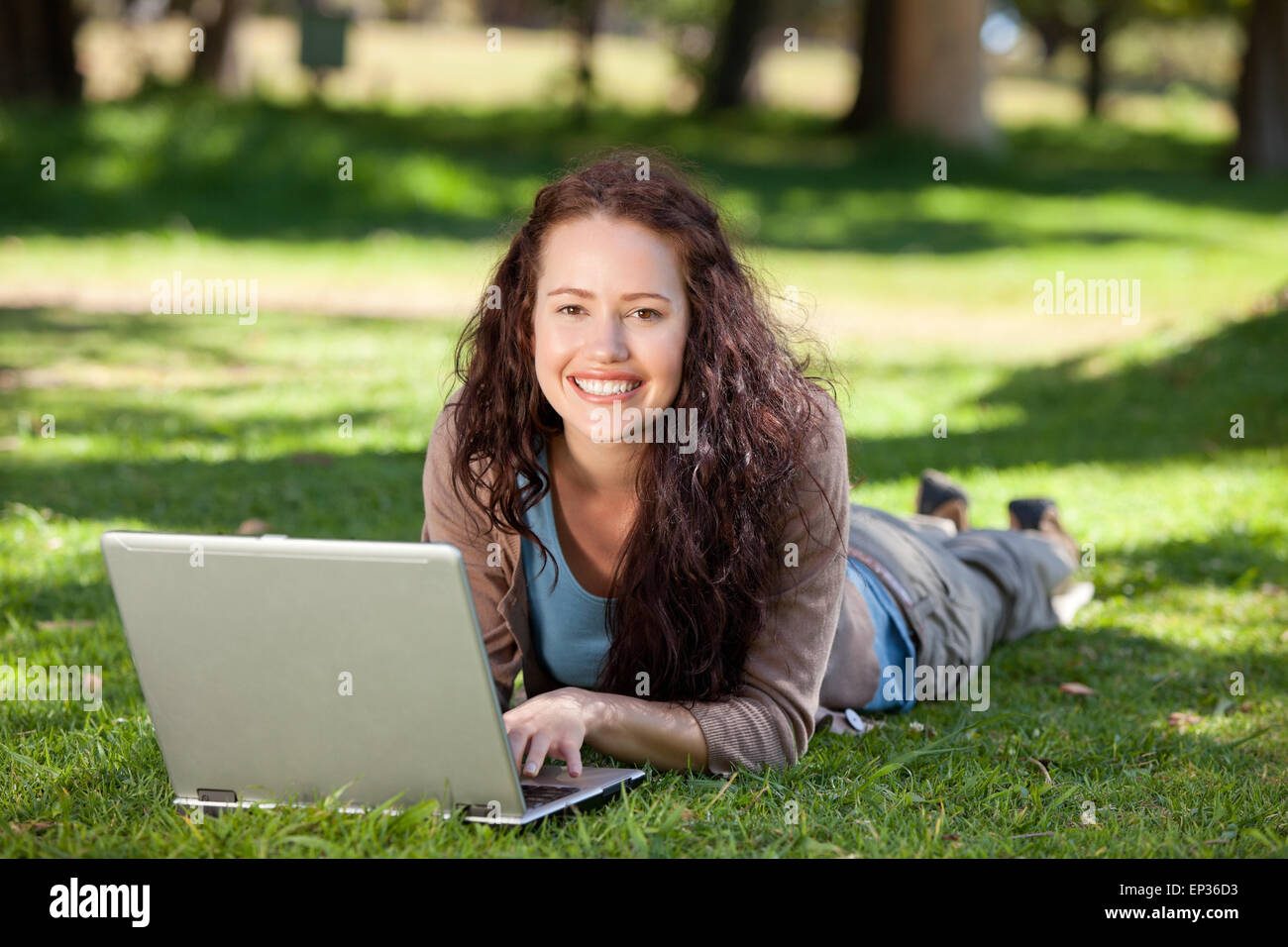 Woman working on her laptop in the park Stock Photo - Alamy