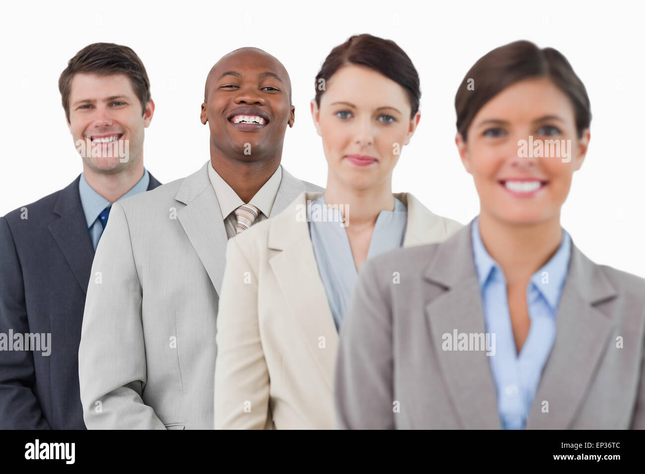 Confident smiling businessteam standing together Stock Photo - Alamy