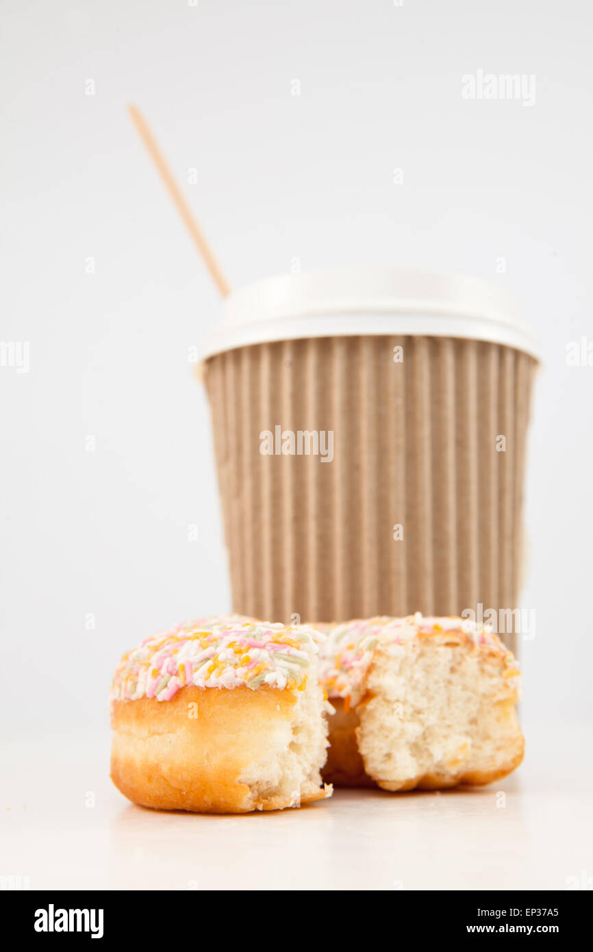 An half eaten doughnut and a cup of tea placed together Stock Photo Alamy