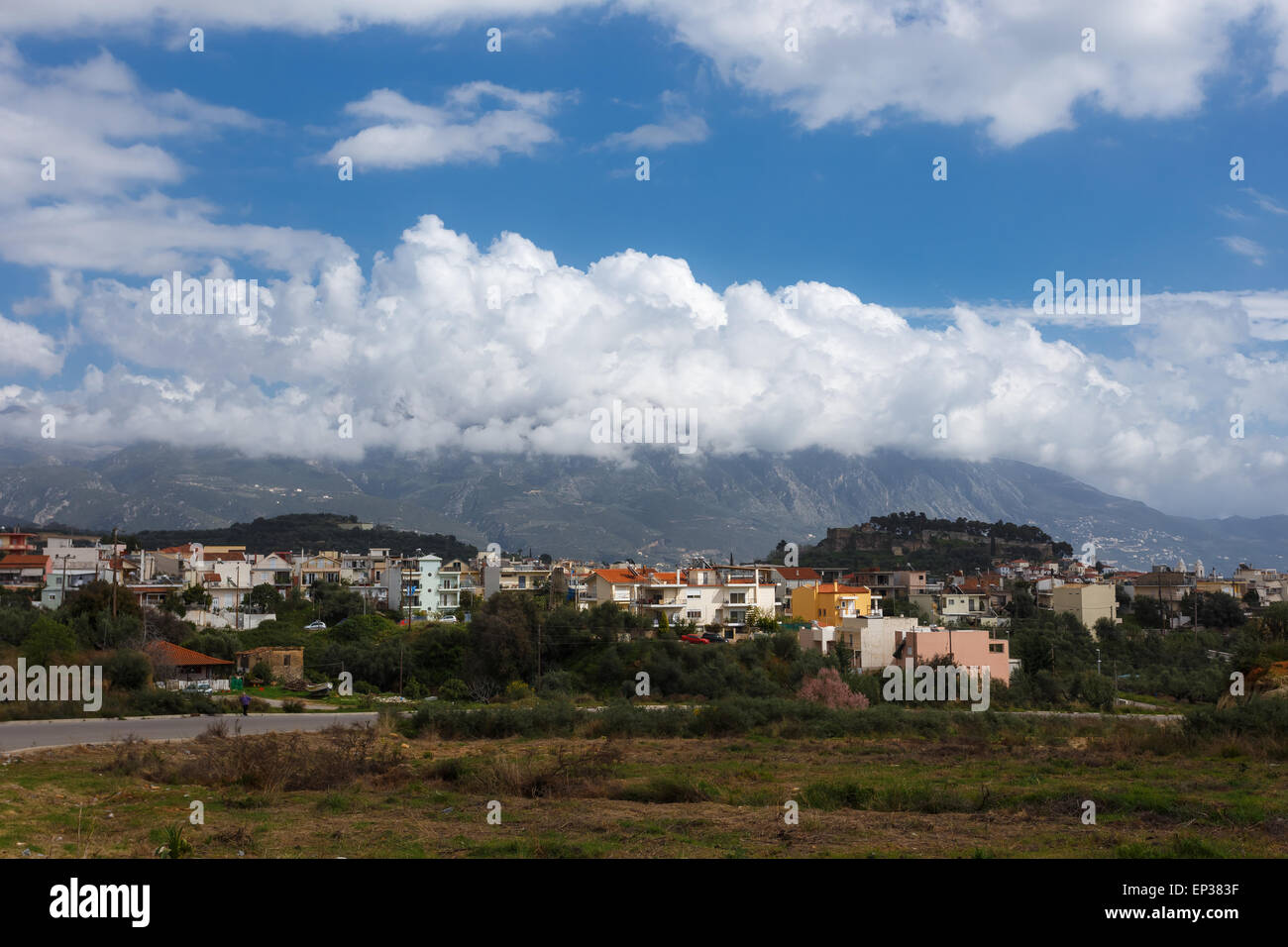 Partial view of Kalamata town with the old medieval fortress on the hill against Taygetos mountain, Messinia prefecture, Greece Stock Photo