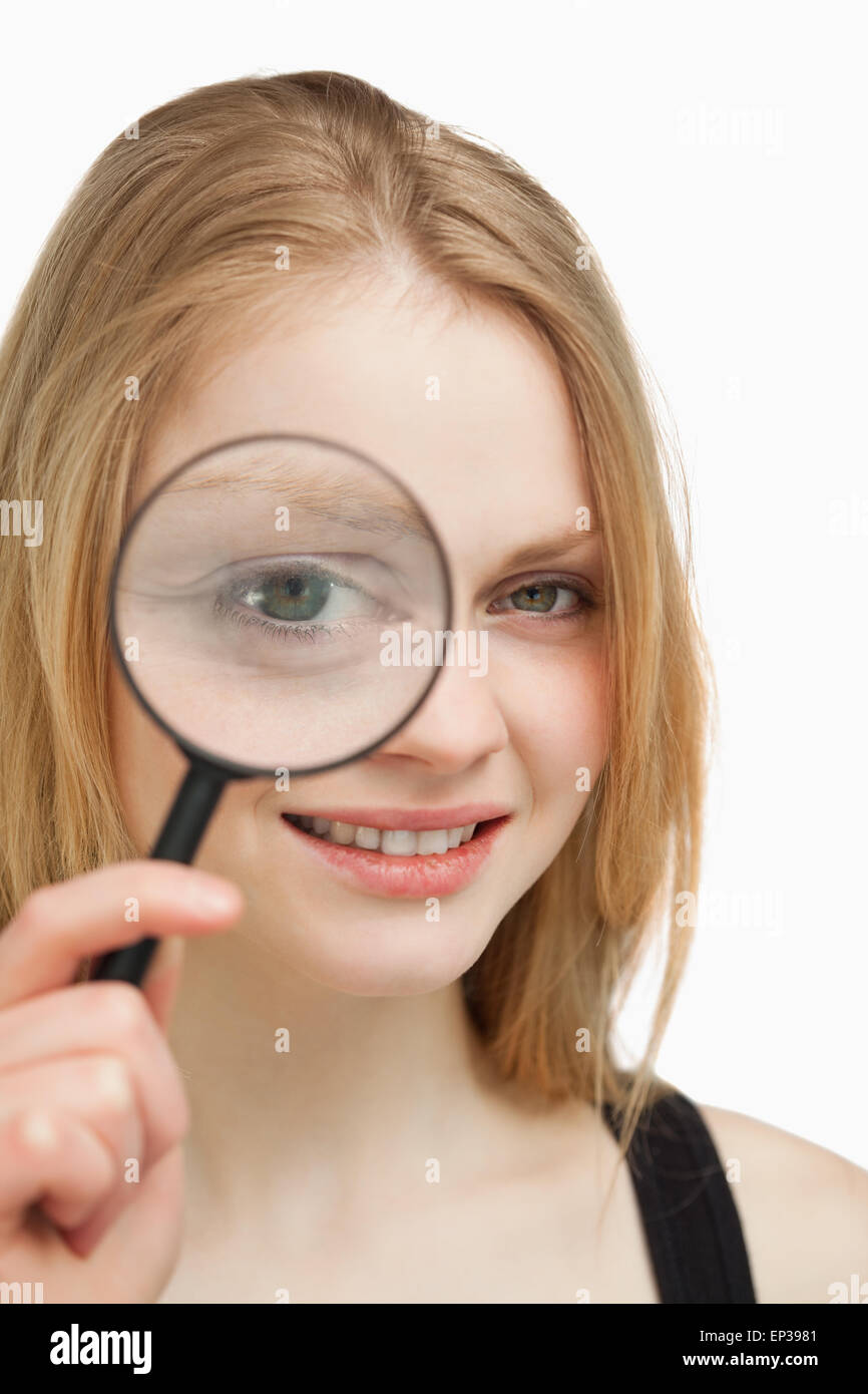 Close up of a woman using a magnifying glass Stock Photo Alamy