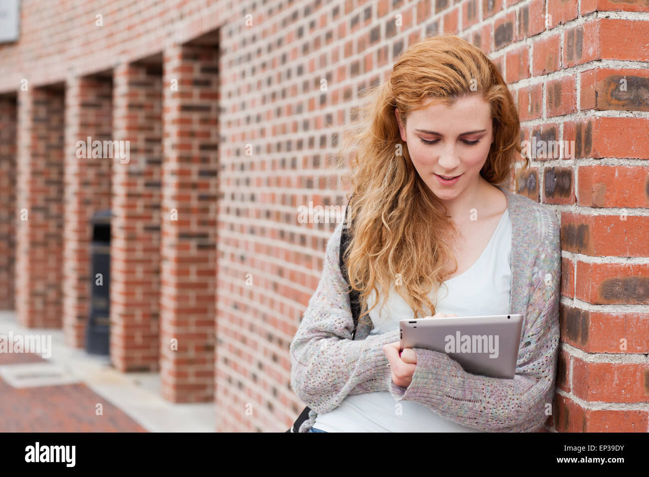 Young student using a tablet computer Stock Photo - Alamy