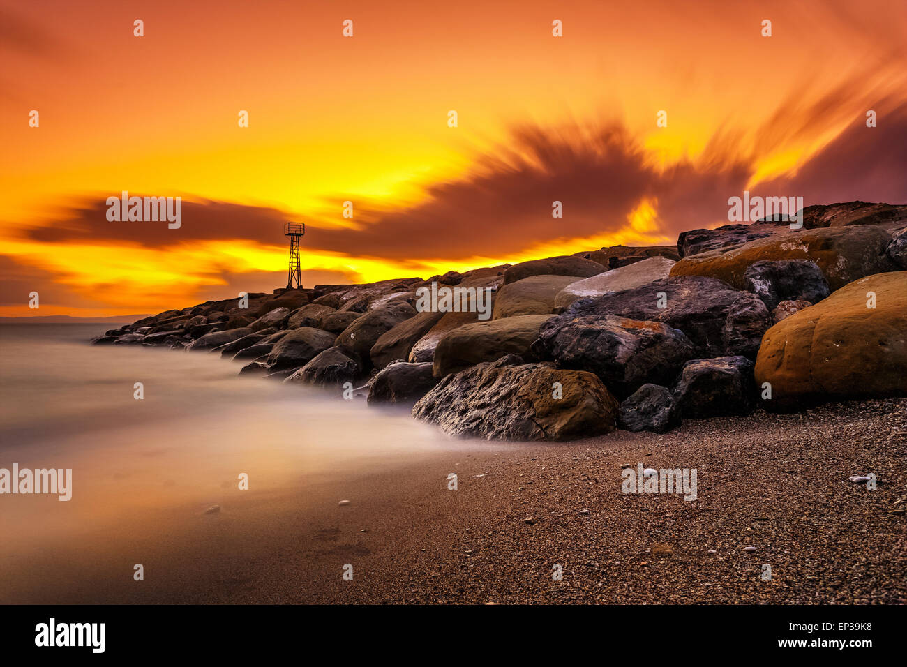 Light beacon and rocky wave breaker near Acroyali village, Messinia ...