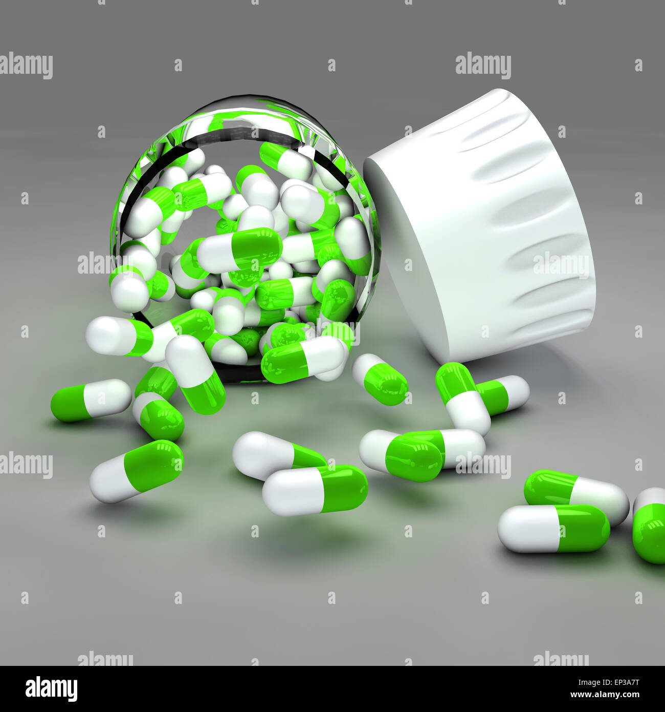 Spilled green and white pills with bottle on gray background Stock Photo