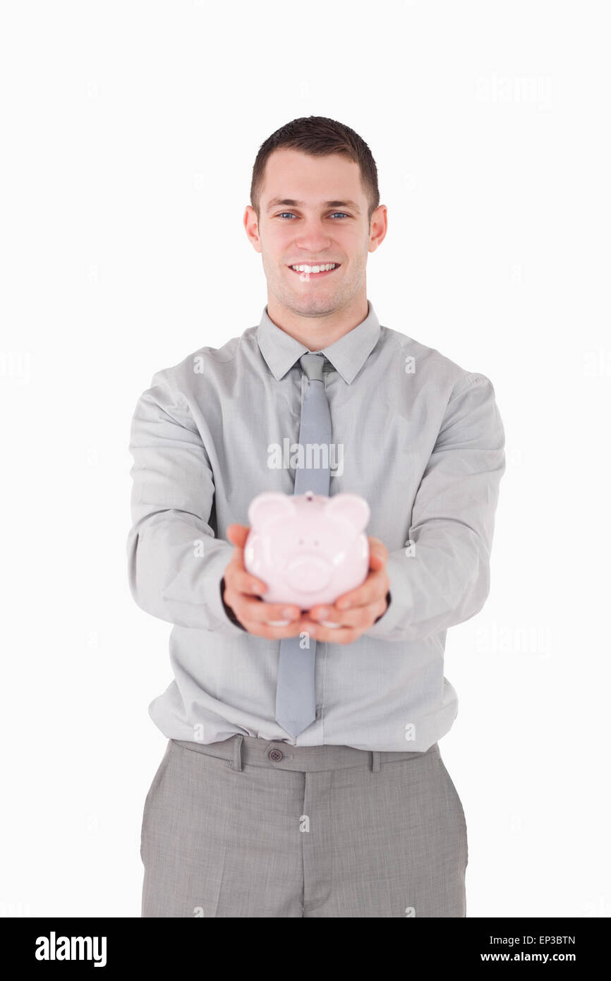 Portrait of a businessman holding a piggy bank Stock Photo - Alamy