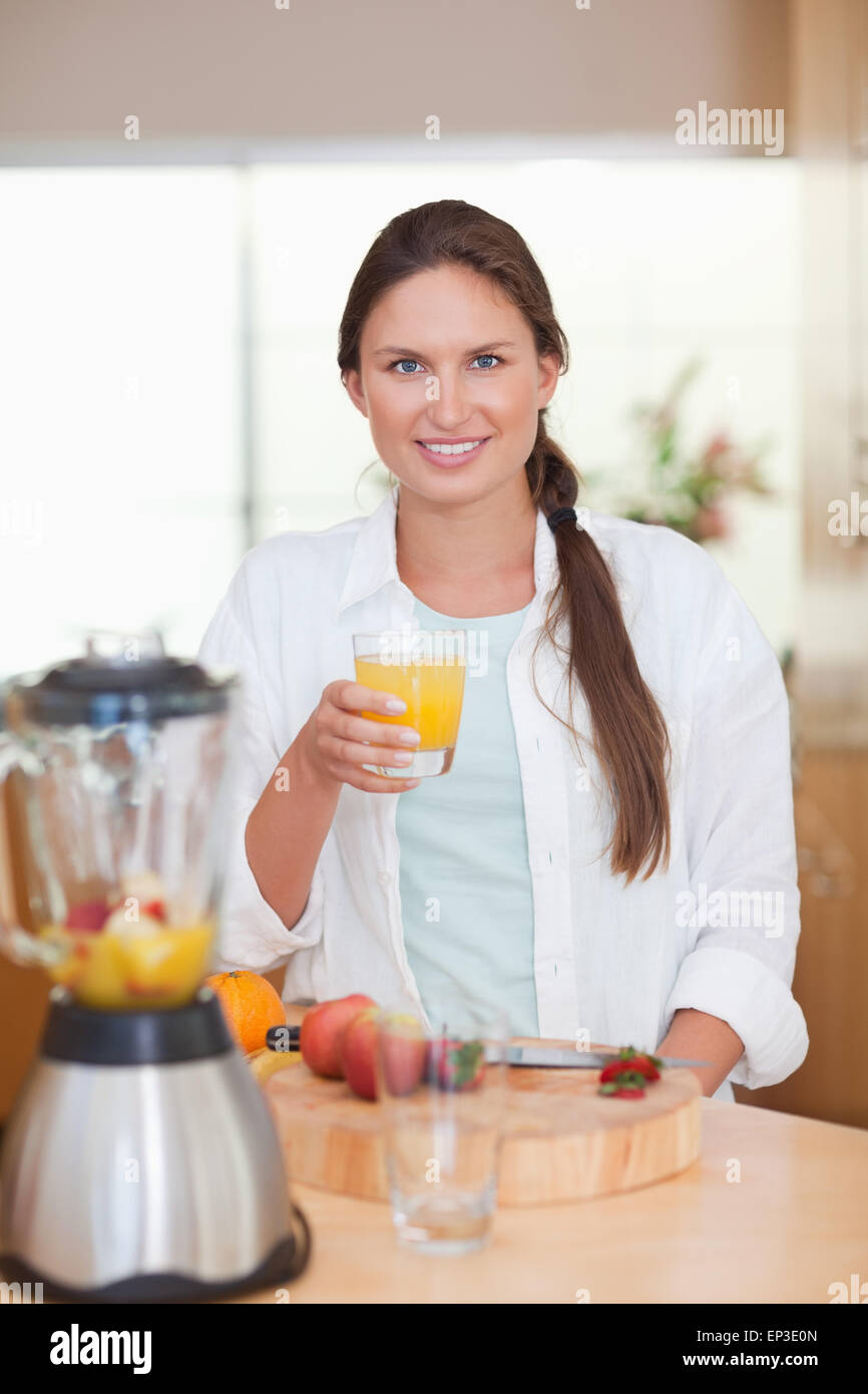 Portrait of a young woman drinking fresh fruits juice Stock Photo Alamy