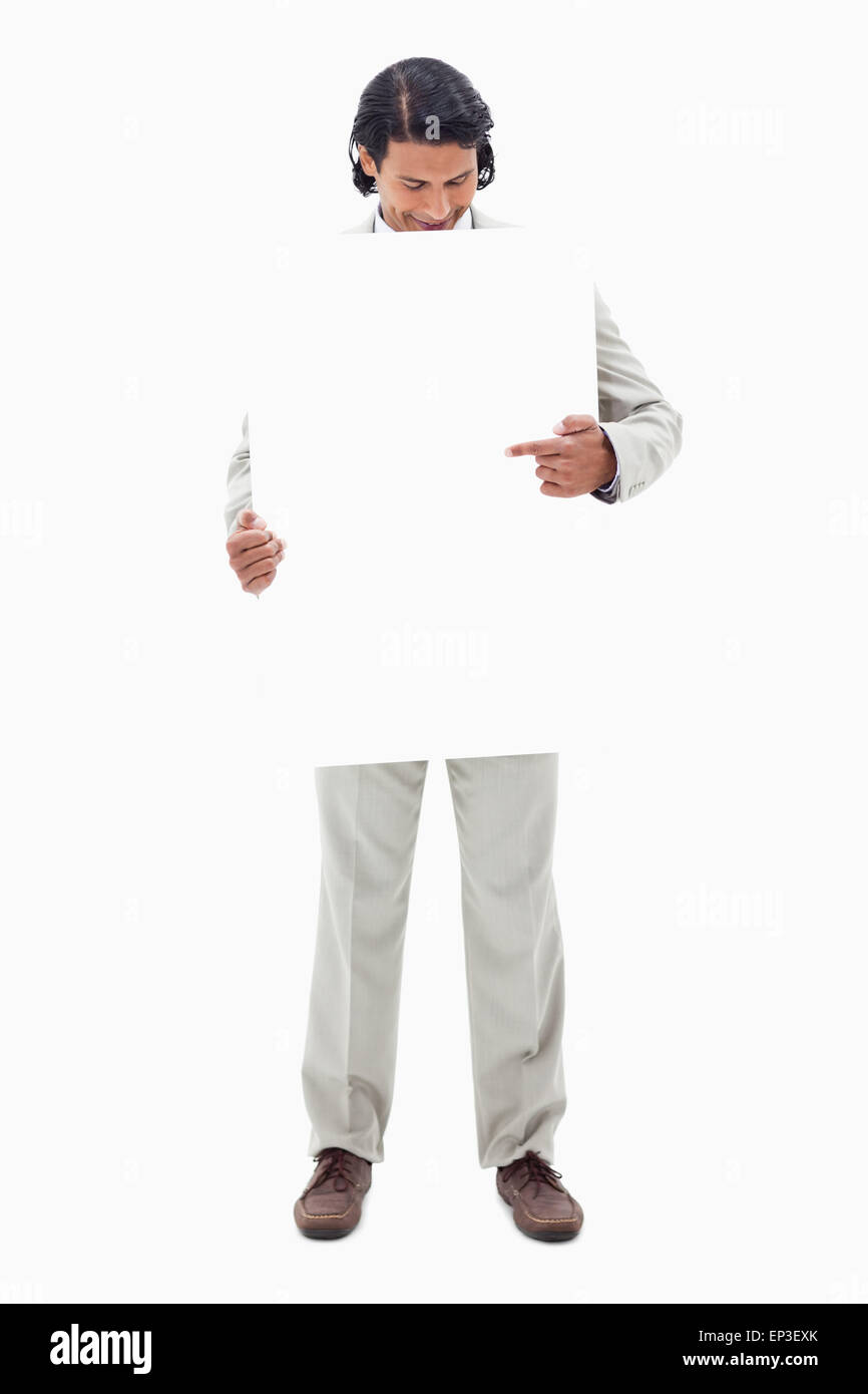 Sign Without Looking Businessman looking and pointing at blank sign in his hands Stock Photo ...