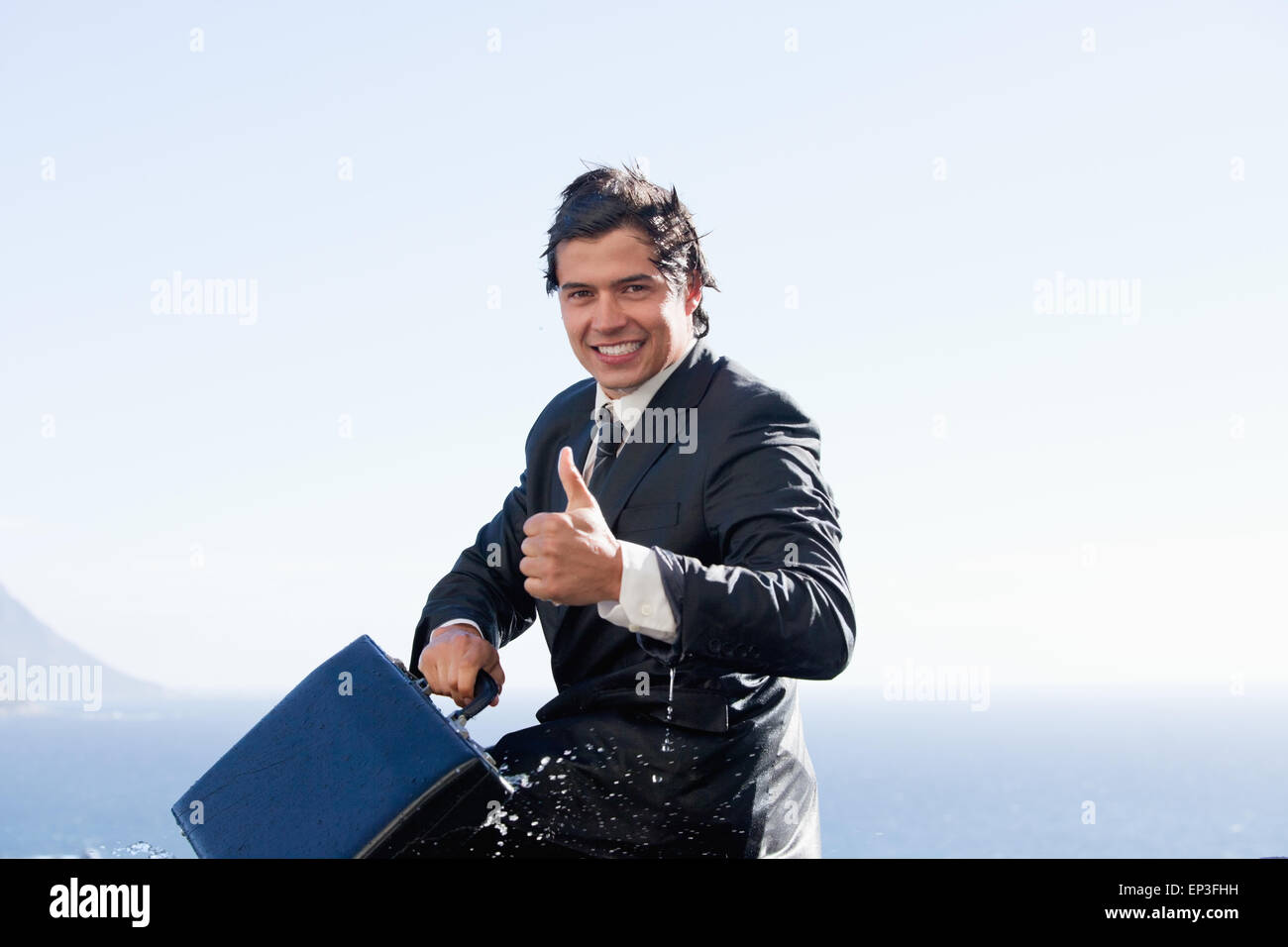 Cheerful businessman with the thumb up Stock Photo - Alamy