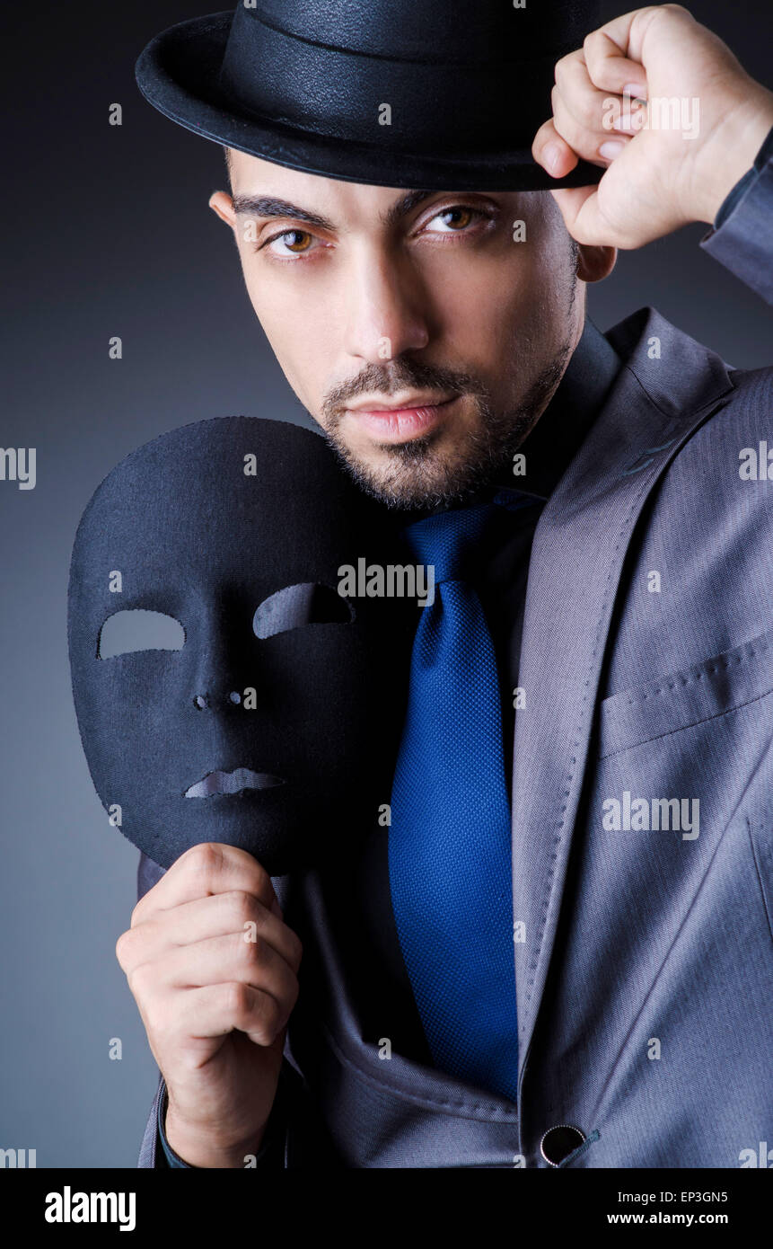 Man with black mask in studio Stock Photo Alamy