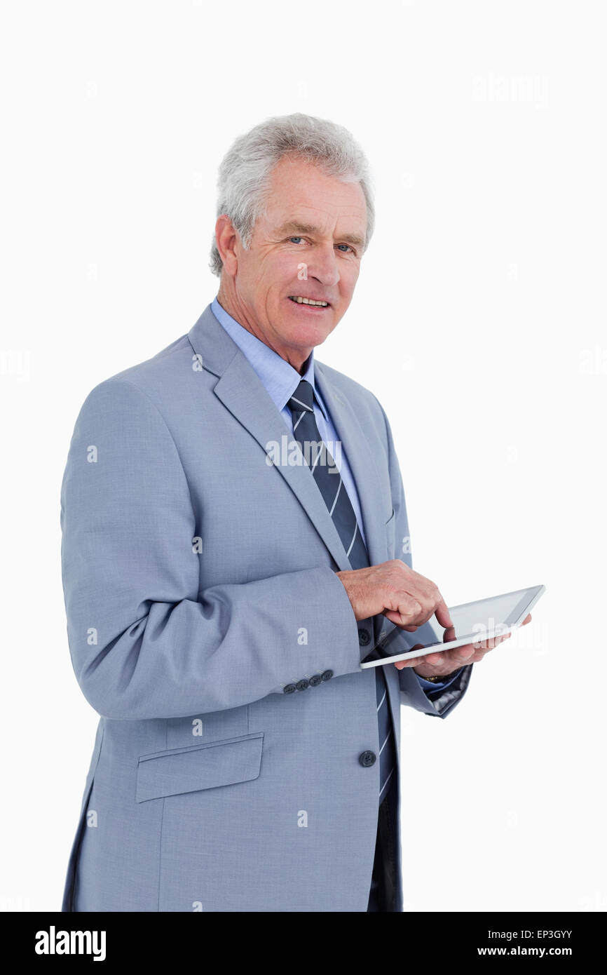 Side view of mature tradesman with tablet computer Stock Photo