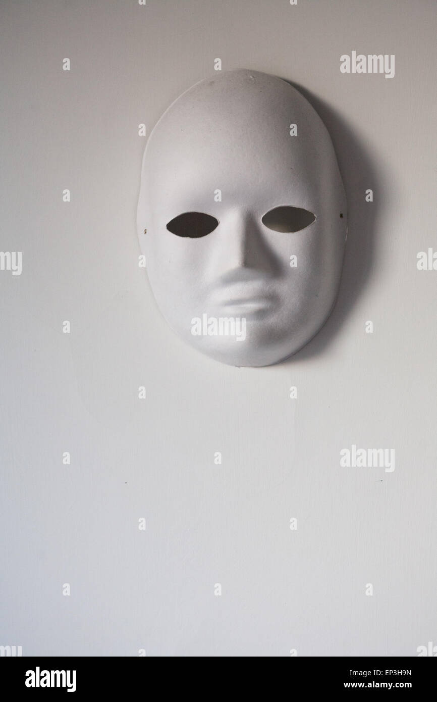 White mask with real eyes on a white background Stock Photo - Alamy