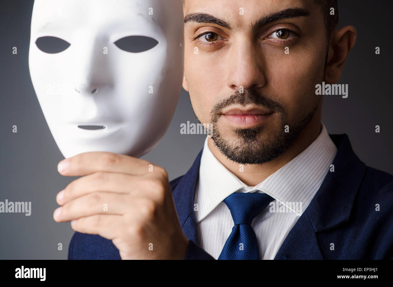 Man with black mask in studio Stock Photo Alamy