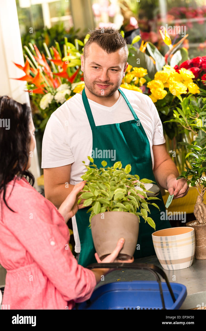Smiling male florist selling potted plant flower Stock Photo Alamy