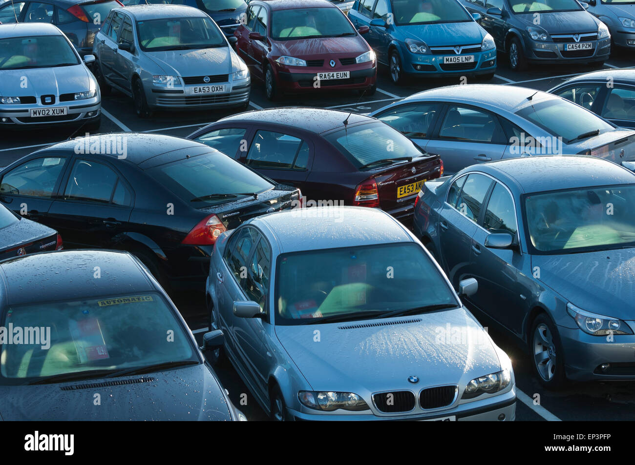 Wet cars parked outside at a secondhand car supermarket Stock Photo Alamy